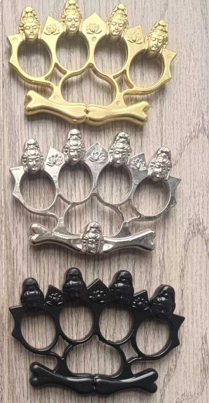 Four-finger self-defense finger buckle -- knuckle duster -- fist buckle -- made of zinc alloy, strong and wear-resistant, with Buddha head decoration