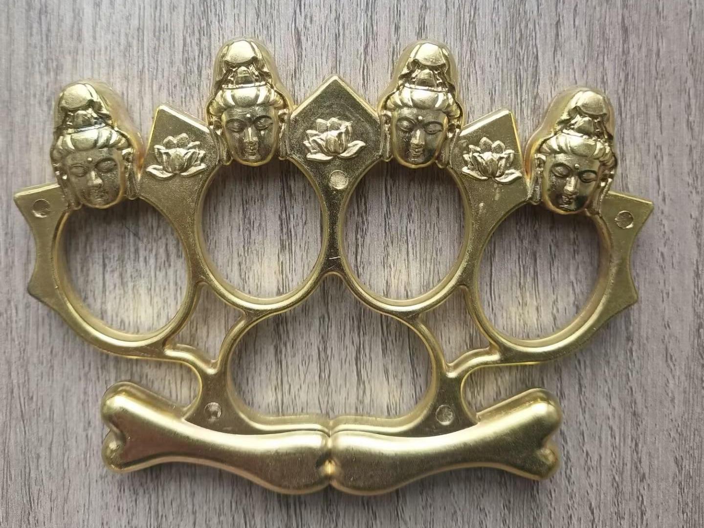 Four-finger self-defense finger buckle -- knuckle duster -- fist buckle -- made of zinc alloy, strong and wear-resistant, with Buddha head decoration
